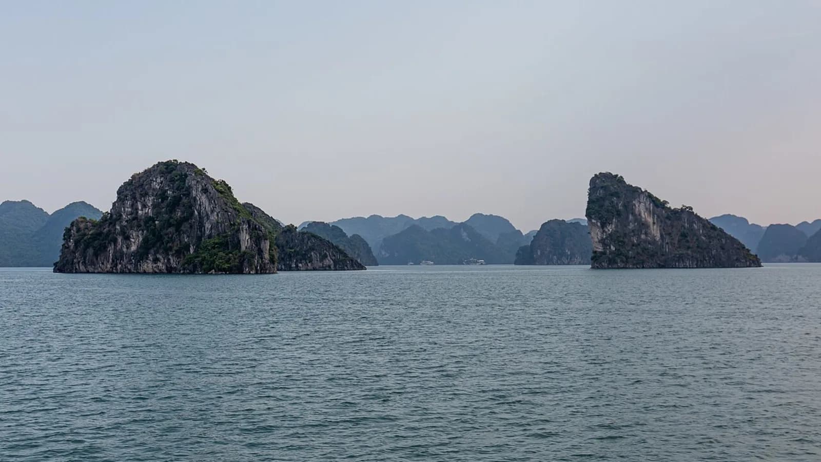 Limestone karsts rising from the water in Ha Long Bay